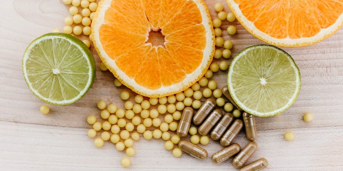 oranges, peas, and limes on a wooden table